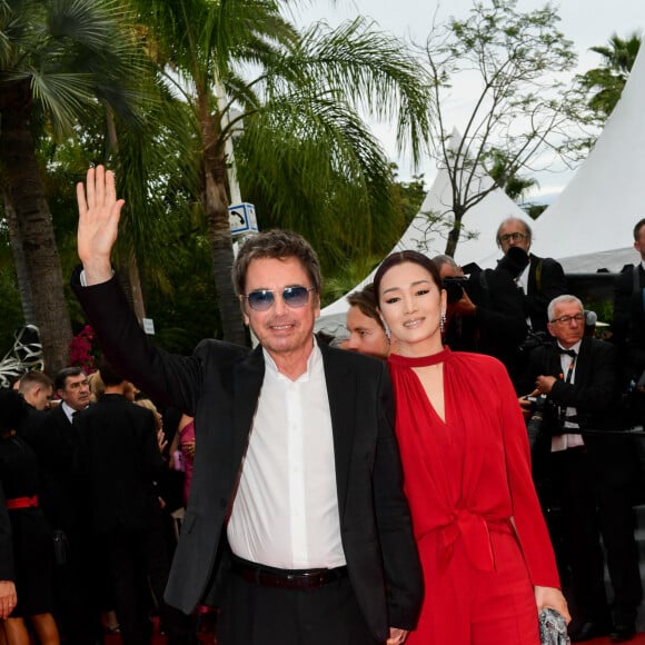 Gong Li et son compagnon Jean-Michel Jarre - Montée des marches du film " Indiana Jones et le cadran de la destinée (Indiana Jones and the Dial of destiny) " lors du 76ème Festival International du Film de Cannes, au Palais des Festivals à Cannes. Le 18 mai 2023 © Rachid Bellak / Bestimage  Red carpet of the movie " Indiana Jones and the Dial of destiny " during the 76th Cannes International Film Festival at the Palais des Festivals in Cannes, France. On may 18th 2023