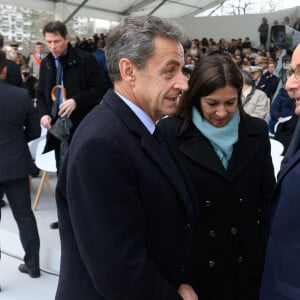 Nicolas Sarkozy, Anne Hidalgo et François Hollande lors d'une cérémonie d'hommage aux victimes du terrorisme sur l'Esplanade du Trocadéro à Paris, à l'occasion de la première journée nationale d'hommage aux victimes du terrorisme. Le 11 mars 2020. Photo par Jacques Witt/Pool/ABACAPRESS.COM
