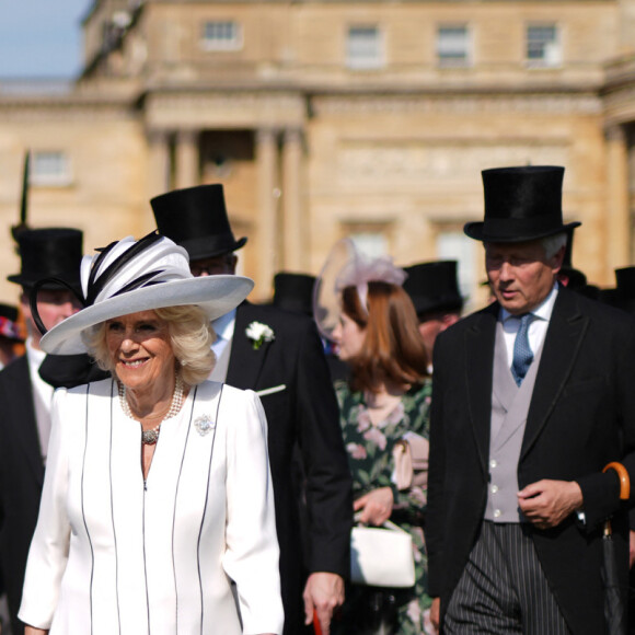 Ce qui n'a pas toujours été pour plaire à Camilla
Le roi Charles III d'Angleterre et Camilla Parker Bowles, reine consort d'Angleterre, reçoivent des invités lors d'une Garden Party à Buckingham Palace à Londres, le 8 mai 2024. 