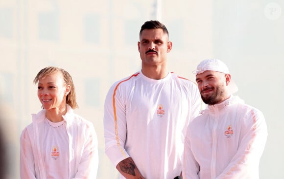 Florent Manaudou, Jul - lors de la cérémonie d'arrivée de la flamme olympique au Vieux-Port de Marseille, France, le 8 mai 2024, avant les Jeux olympiques et paralympiques de Paris 2024. Le transfert de la flamme à terre d'un navire de haut du XIXème siècle marquera le début du relais de la torche olympique de 12 000 kilomètres (7500 milles) à travers la France. © Dominique Jacovides/Bestimage  Olympic Flame arrival ceremony at the Vieux-Port, ahead of the Paris 2024 Olympic and Paralympic Games, in Marseille, France, on May 8, 2024. The transfer of the flame onshore from a 19th-century tall ship will mark the start of a 7,500 mile torch relay across mainland France. 