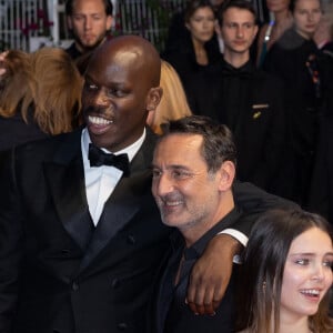 Jean-Pascal Zadi, Gilles Lellouche, Mallory Wanecque - Descente des marches du film « L’amour ouf » lors du 77ème Festival International du Film de Cannes, au Palais des Festivals à Cannes. Le 23 mai 2024 © Olivier Borde / Bestimage