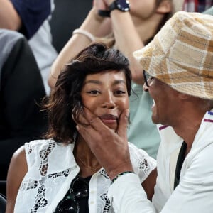 Yannick Noah et sa compagne Malika - Les célébrités en tribunes pendant l'épreuve de basketball de Demi-Finale opposant la France à l'Allemagne lors des Jeux Olympiques de Paris 2024 (JO) à l'Arena Bercy, à Paris, France, le 8 août 2024. © Jacovides-Perusseau/Bestimage 