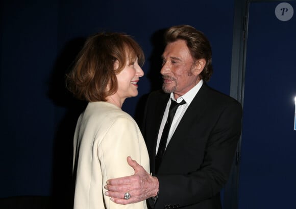 Nathalie Baye et Johnny Hallyday - Avant-première de 'Salaud on t'aime' à l'UGC Normandie sur les Champs-Elysées à Paris le 31 mars 2014.