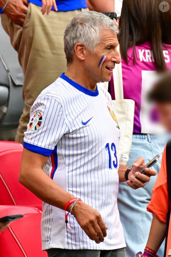 Nagui dans les tribunes de la demi-finale du Championnat d'Europe de football (Euro 2024) entre l'Espagne et la France (2-1) à Munich, Allemagne, le 9 juillet 2024. © Bestimage 