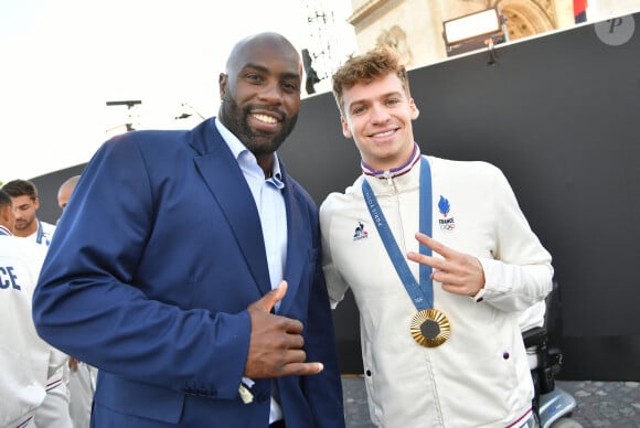 Exclusif - Teddy Riner, Léon Marchand - Remise des médailles par le président de la République à l'Arc de Triomphe aux athlètes lors de la parade des champions à l'occasion des Jeux Olympiques et Paralympiques Paris 2024, sur l'avenue des Champs-Elysées à Paris. Le 14 septembre 2024 © Perusseau-Ramsamy / Bestimage 