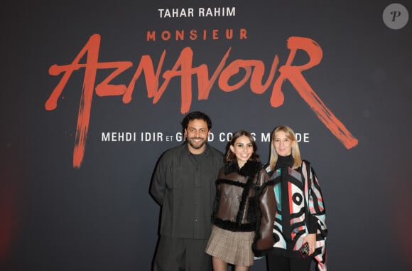 Jean-Rachid Kallouche (producteur), et Katia Aznavour (fille de C.Aznavour) et leur fille Leila lors de l'avant-première du film "Monsieur Aznavour" au cinéma Le Grand Rex à Paris le 22 octobre 2024. © Coadic Guirec / Bestimage