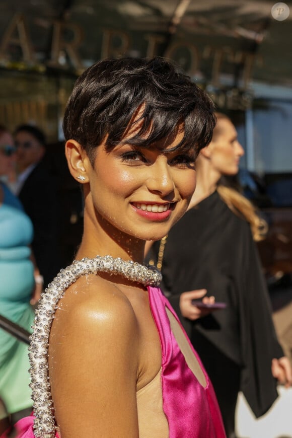 Cannes, FRANCE - Ève Gilles rocks the red carpet in an eye-catching, huge pink satin gown from Stephane Rolland's Spring 2020 Couture collection. Pictured: Ève Gilles 