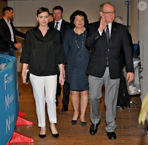 Exclusif - La princesse Charlene de Monaco, son frère Gareth Wittstock, Mme Yvette Lambin-Berti, secrétaire général du Comité Olympique Monégasque, et le prince Albert II de Monaco durant le 40eme Meeting International Natation de Monte-Carlo à la piscine du stade Louis II de Monaco, le 21 mai 2023 © Bruno Bebert/Bestimage