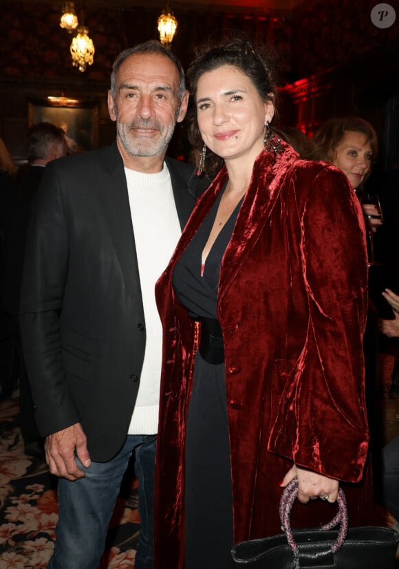 Exclusif - Emmanuelle Galabru et son compagnon Christian Cartier - Défilé rétrospectif Nathalie Garçon à l'occasion de ses 35 ans de sa marque lors d'une closing party à l'hôtel Raphael à Paris le 19 novembre 2024.e