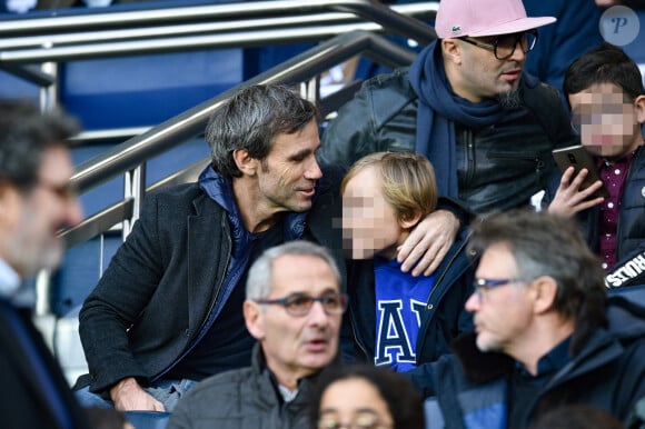 David Pujadas et son fils assistent au match de Ligue 1 Conforama PSG 5-0 Montpellier au Parc des Princes à Paris le 1 février 2020 © Giancarlo Gorassini / Bestimage 