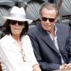 Michel Leeb et son épouse Béatrice lors de la trosième journée du tournoi des internationaux de tennis de Roland Garros le 25 mai 2010