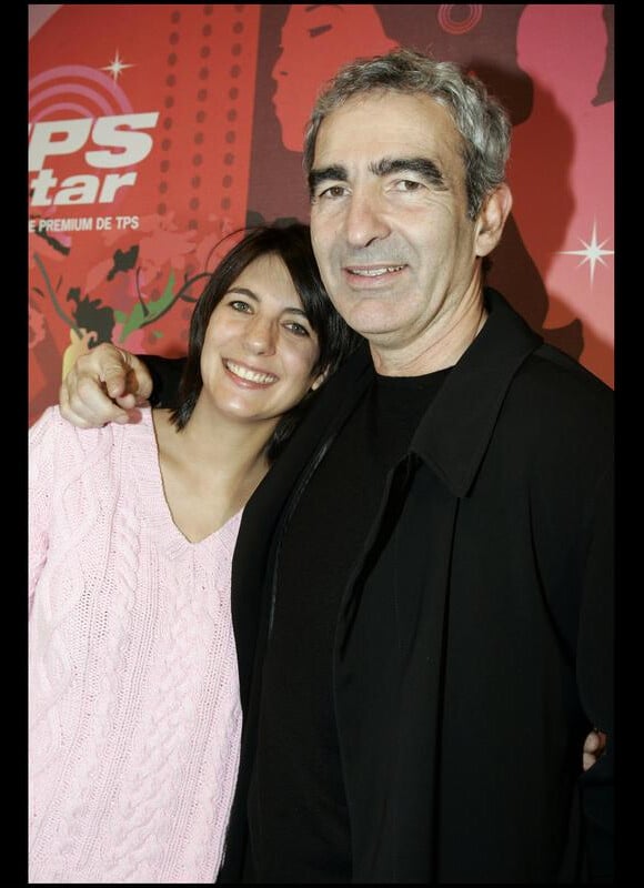 Estelle Denis et Raymond Domenech en 2004 lors d'une soirée TPS à Paris