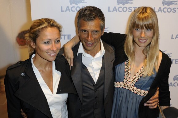 Anne-Sophie Lapix, Nagui et son épouse Mélanie Page lors de la soirée d'ouverture du flagship Lacoste sur les Champs-Elysées à Paris le 28 avril 2011
