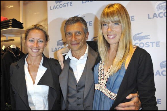 Anne-Sophie Lapix, Nagui et Mélanie Page lors de la soirée d'ouverture de la boutique Lacoste 95 avenue des Champs Elysées à Paris, le 28 avril 2011