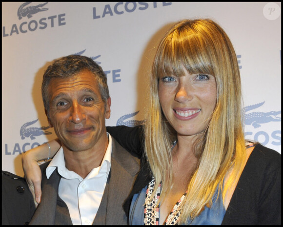 Nagui et sa délicieuse épouse Mélanie Page lors de la soirée d'ouverture de la boutique Lacoste 95 avenue des Champs Elysées à Paris, le 28 avril 2011