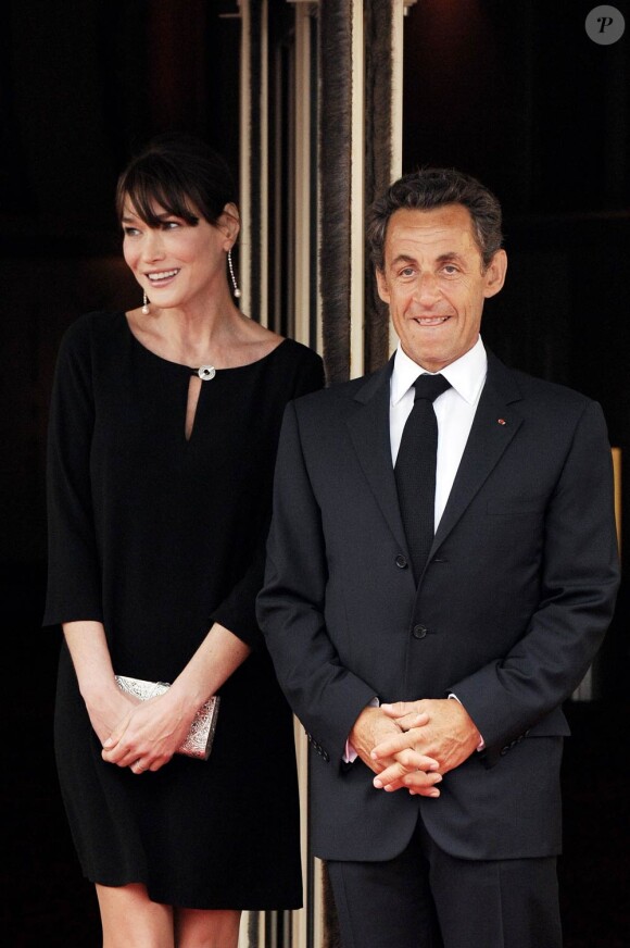 Carla Bruni-Sarkozy, enceinte, à Deauville en mai 2011. Son époux Nicolas Sarkozy est à ses côtés.