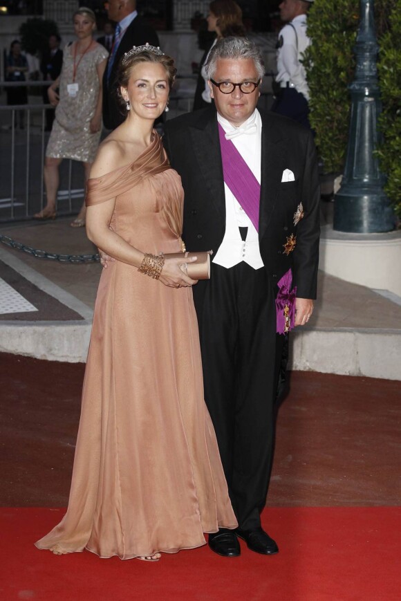 Le prince Laurent de Belgique et son épouse la princesse Claire (photo : le 2 juillet 2011 à Monaco pour le dîner du mariage d'Albert et Charlene) sont exclus des représentations officielles de la famille royale, dont les cérémonies de la Fête Nationale du 21 juillet 2011.