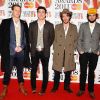 Le groupe anglais Mumford & Sons pose lors des British Awards à Londres en février 2011