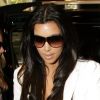 La fashionista Kim Kardashian apprécie la marque espagnole Zara. Ici, avec un blazer de la marque assorti à un sac Birkin par Hermès. Sydney, le 28 avril 2010.