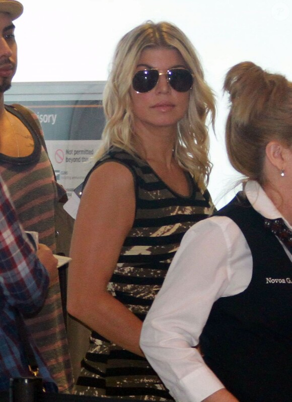 Fergie arrive à l'aéroport de Miami le 13 septembre 2011