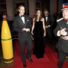 Escortée par son mari le prince William et son beau-frère le prince Harry, Catherine, duchesse de Cambridge, véritable joyau de velours noir,  honorait le 19 décembre 2011 la soirée A Night of Heroes pour les Sun  Military Awards.