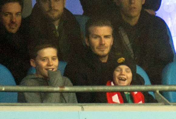 David Beckham et ses enfants Brooklyn, Romeo et Cruz, le 8 janvier 2012 à Manchester, lors de la victoire de United sur City (3-2).