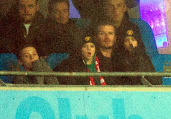 David Beckham et ses enfants Brooklyn, Romeo et Cruz le 8 janvier 2012 à Manchester lors de la victoire de United sur City (3-2).
