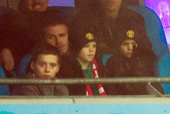 David Beckham et ses fils Brooklyn, Romeo et Cruz le 8 janvier 2012 à Manchester lors de la victoire de United sur City (3-2).