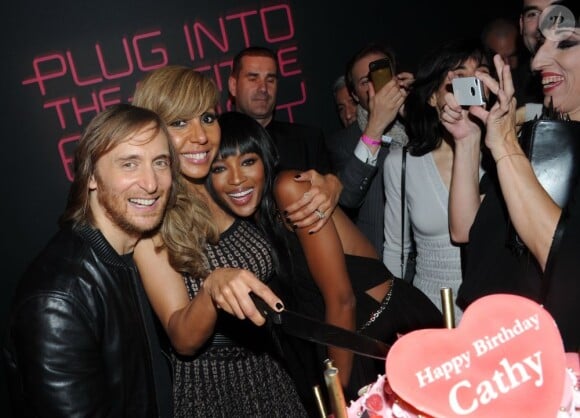 David et Cathy Guetta aux côtés de Naomi Campbell lors de la soirée de lancement de la Twizy à l'Atelier Renault sur les Champs-Elysées à Paris le mardi 28 mars 2012