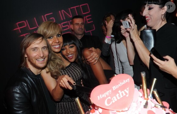 David et Cathy Guetta aux côtés de Naomi Campbell lors de la soirée de lancement de la Twizy à l'Atelier Renault sur les Champs-Elysées à Paris le mardi 28 mars 2012