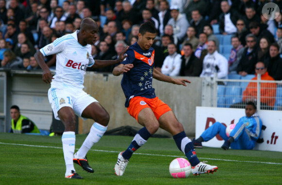 Djimi Traoré et Younes Belhanda le 11 avril 2012 au Stade Vélodrome de Marseille pour le match entre l'OM et Montpellier (1-3)