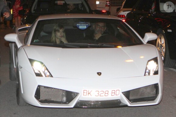 Christian Audigier arrive avec sa chérie Nathalie Sorensen pour fêter son anniversaire chez Jean-Roch, dans son VIP ROOM de Cannes le 17 mai 2012