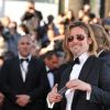 Brad Pitt monte les marches du Palais des Festivals, pour son film Cogan - La Mort en Douce, à Cannes le 22 mai 2012
