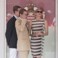  Charlene en conversation avec Pierre et Andrea Casiraghi. 
 La princesse Charlene assistait au côté du prince Albert au Grand Prix de Monaco, le 27 mai 2012. A l'issue de la course, qu'elle a suivie en compagnie des neveux de son époux, les frères Andrea et Pierre Casiraghi, elle remettait le trophée du deuxième, l'Allemand Nico Rosberg. 