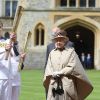 Elizabeth II et son mari le prince Philip ont accueilli au château de Windsor la flamme olympique, le 10 juillet 2012, lors du 53e jour du relais de la torche olympique, assistant au passage de témoin entre Gina Macgregor et Phil Wells.