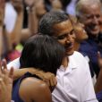 Michelle et Barack Obama assistent à un match de l'équipe olympique féminine de basket contre le Brésil, à Washington, le 16 juillet 2012