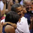 Michelle et Barack Obama assistent à un match de l'équipe olympique féminine de basket contre le Brésil, à Washington, le 16 juillet 2012