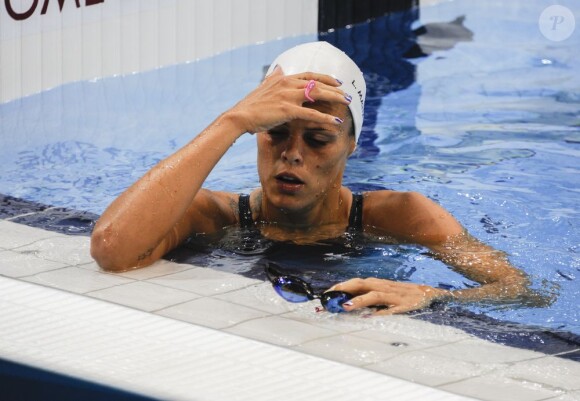Laure Manaudou déçue après son élimination en série du 100 mètres dos le 29 juillet 2012 à l'Aquatics Center de Londres lors des Jeux olympiques 2012