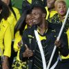 Usain Bolt, porte-drapeau de la délégation jamaïcaine lors de la cérémonie d'ouverture des Jeux olympiques de Londres 2012. 27 juillet