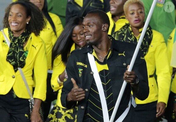 Usain Bolt, porte-drapeau de la délégation jamaïcaine lors de la cérémonie d'ouverture des Jeux olympiques de Londres 2012. 27 juillet