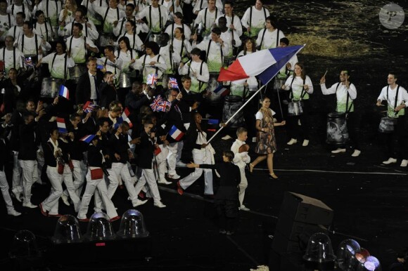 Laura Flessel, fière porte-drapeau de la délégation française lors de la cérémonie d'ouverture des Jeux olympiques de Londres 2012. 27 juillet