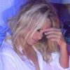 Pamela Anderson, légèrement assommée par le champagne, fait la fête au Vip Room de Saint Tropez le 31 juillet 2012