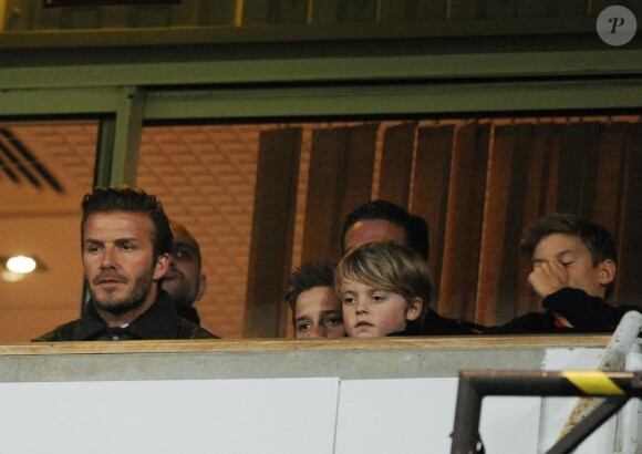 David Beckham et ses fils, Roméo, Cruz et Brooklyn, assistent au match de foot entre les équipes de West Ham United et Manchester United, à Londres, le 5 janvier 2013.