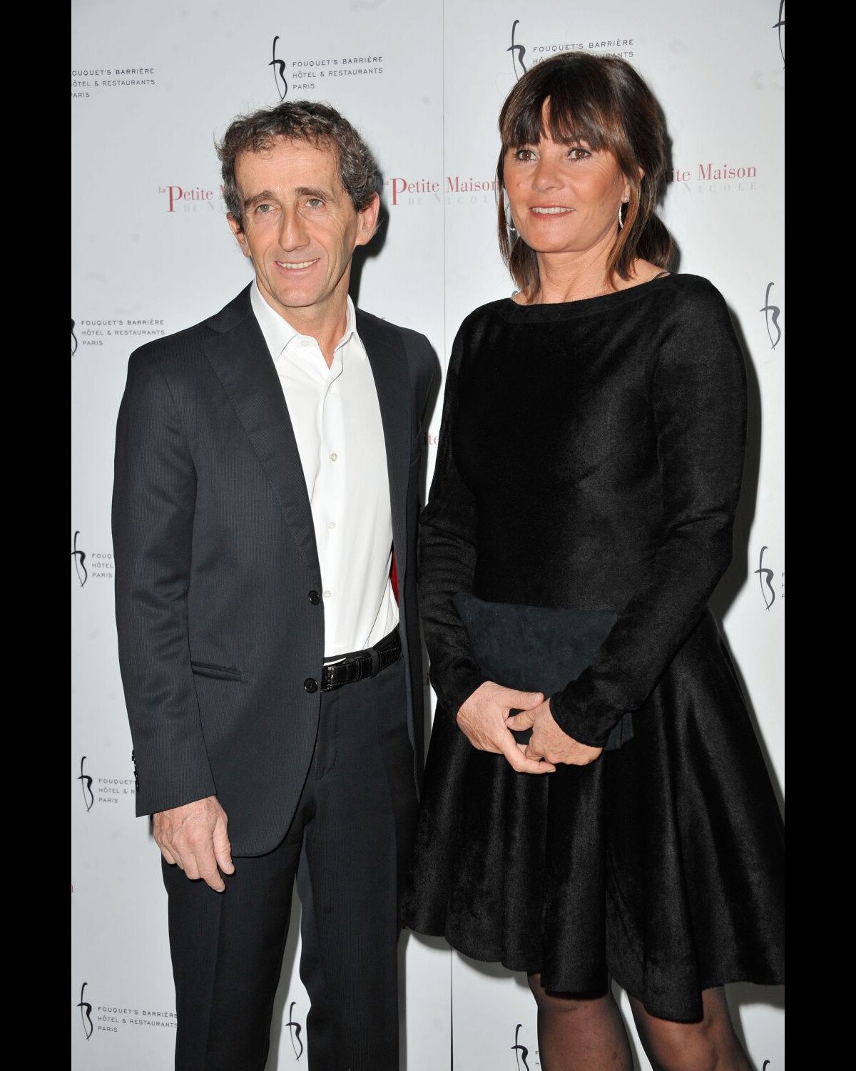 Photo : Alain Prost et sa femme Anne-Marie à linauguration du restaurant  La Petite Maison de Nicole à lHôtel Fouquets Barrière à Paris, le 21  janvier 2013. - Purepeople