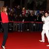 Isabelle Funaro dans son rôle de mannequin pour un Michaël Youn photographe avant les NRJ Music Awards au Palais des Festivals à Cannes le 26 janvier 2013.