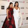 Kim Kardashian, enceinte, et sa soeur Kourtney Kardashian à la soirée organisée par la fondation Elton John, en marge des Oscars, à Los Angeles, le 24 février 2013.