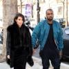 La star de télé-réalité Kim Kardashian et son compagnon Kanye West dans les rues de Paris. Le 4 mars 2013.