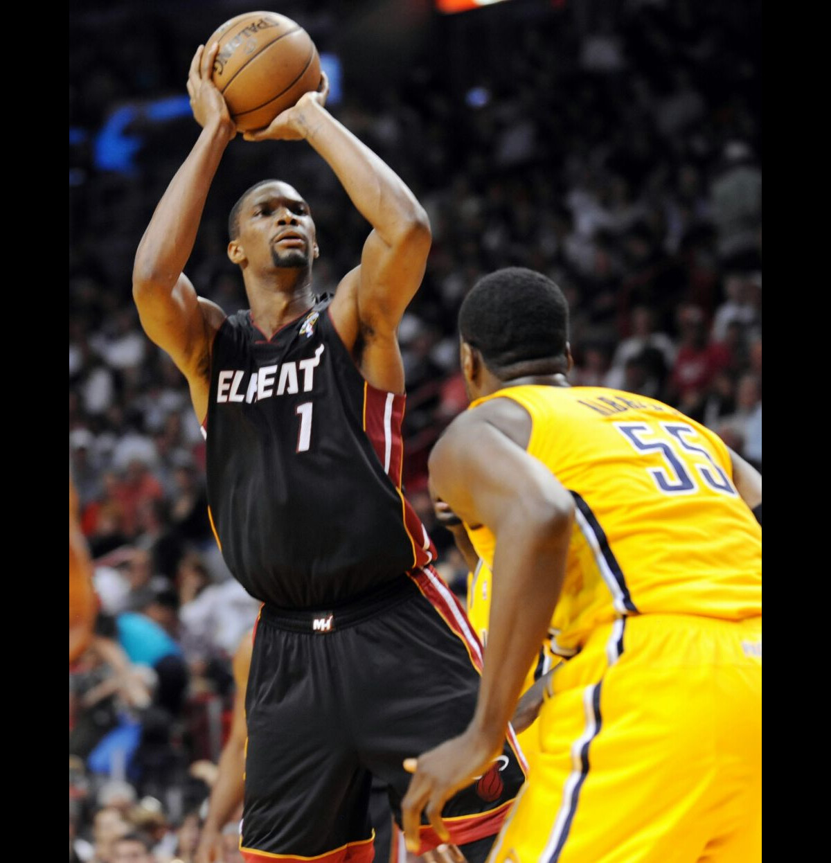 Photo : Chris Bosh of the Miami Heat goes up for a shot in the first ...