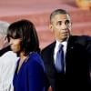 Michelle et Barack Obama rendent hommage aux victimes de l'attentat du marathon de Boston lors d'une cérémonie religieuse dans la cathédrale Sainte-Croix, le 18 avril 2013.