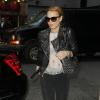 Lindsay Lohan quitte le Schoenfeld Theatre avec un inconnu après avoir vu la pièce Orphan à New York, le 23 avril 2013.